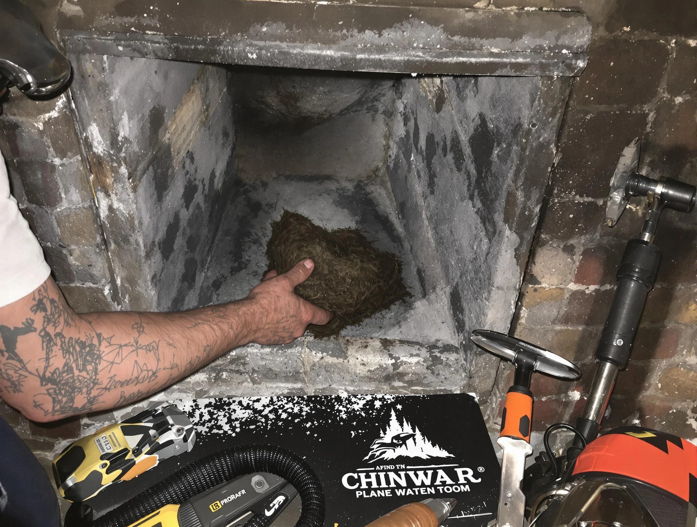 Norwood Chimney Sweep safely removing debris and screening chimney in Norwood, MA